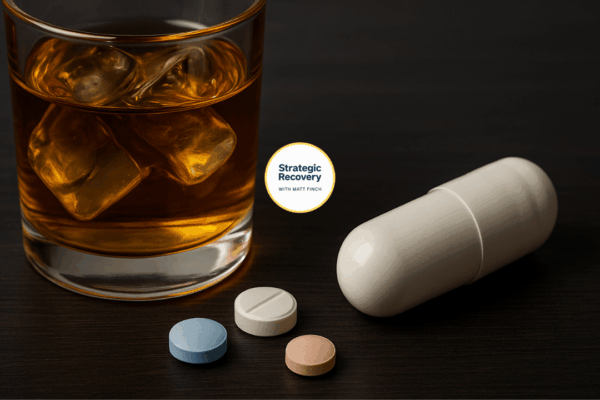 A glass of whiskey beside capsules and tablets on a dark wooden table, symbolizing the concept of Alcohol Replacement Therapy — replacing harmful drinking with science-based, receptor-balancing alternatives for healing and recovery.