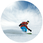 Athlete on a ridge with dramatic mountains and sky, symbolizing the natural high of extreme sports.