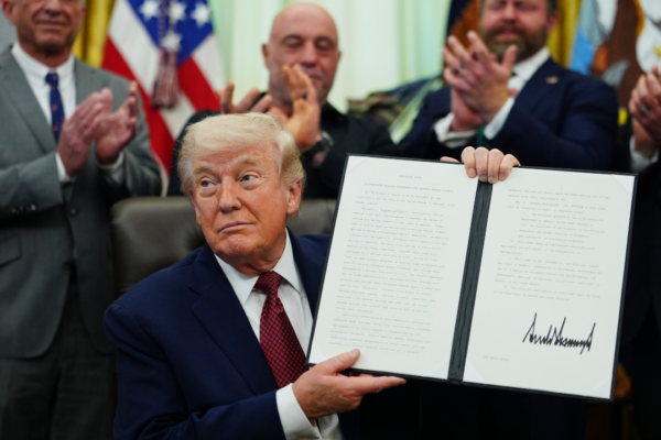Trump showing signed executive order with Joe Rogan and others in the background, to fast-track psychedlics by giving $50 million to FDA for making ibogaine, psilocybin and other psychedelics available.