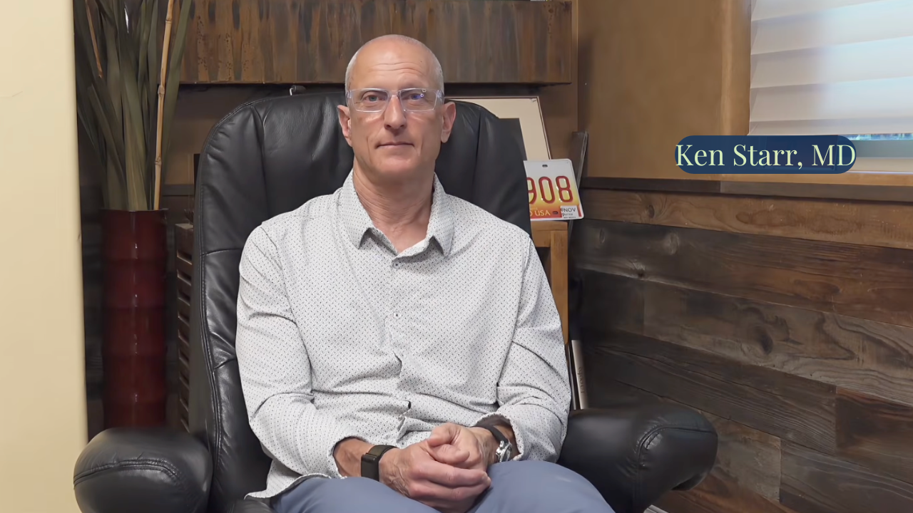 A physician seated in a private office, representing individualized, compassionate outpatient addiction care.